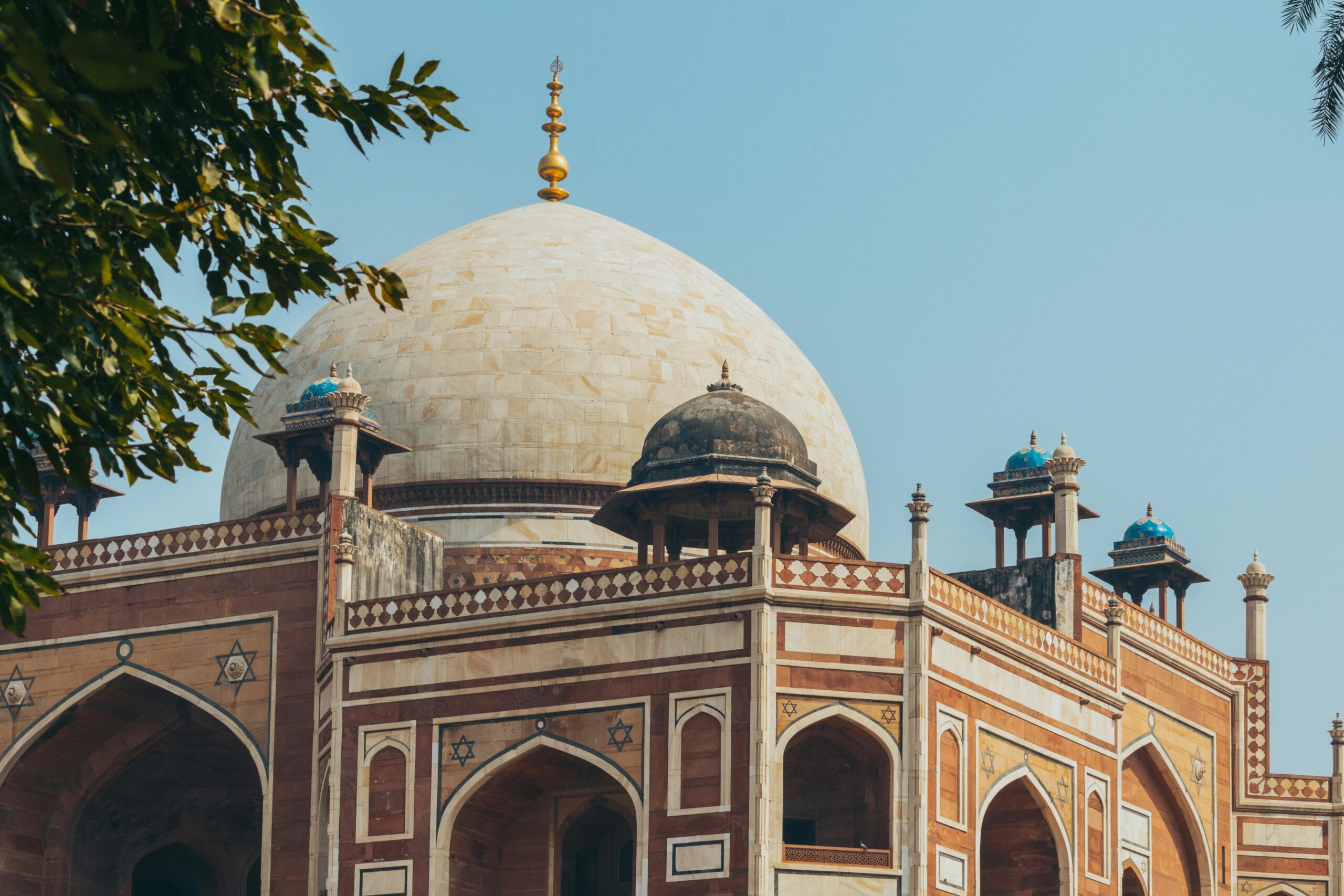 Stunning view of Humayun's Tomb showcasing its intricate architecture and clear blue sky.